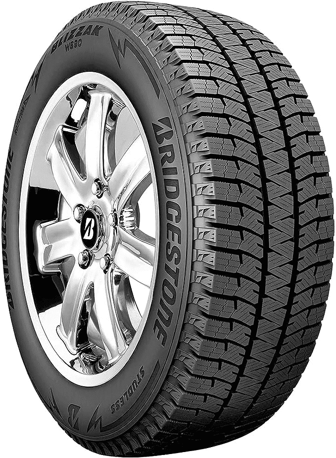 A car with Bridgestone Blizzak WS90 winter tires driving on a snowy road, best snow tire, studded tires